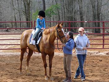 Cassie on Mattie assissted by Cathy and Dawn